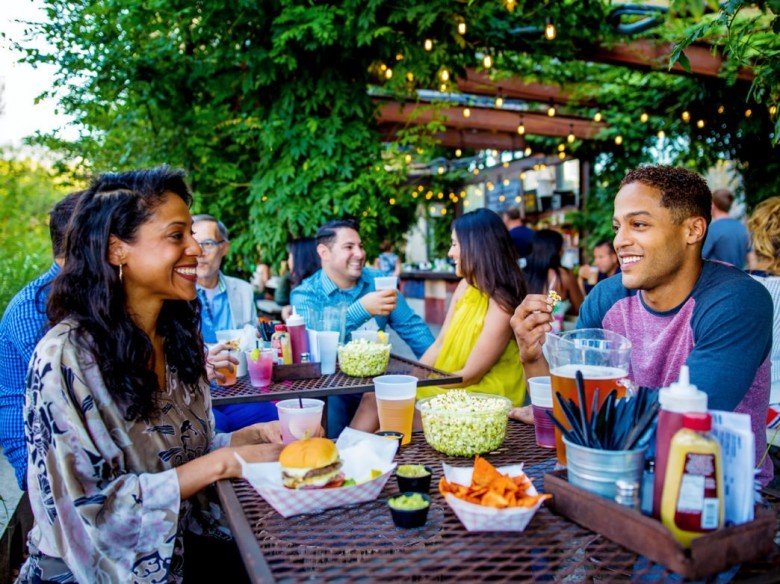 This is Suzy (in the green). She knew the bars would be poppin' on a national holiday and didn't wanna miss an opportunity to party with her friends. She made sure to wash her hands a ton. Is she social distancing?